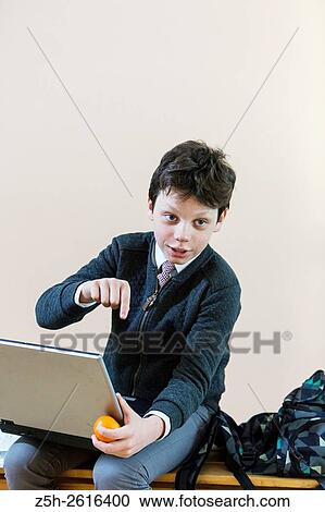 Russia. Belgorod region. Village Solomino. The boy twelve years preparing for school. View Large Photo Image Stock Image - Russia. Belgorod region. Village Solomino. The boy twelve years preparing for school.. Fotosearch
