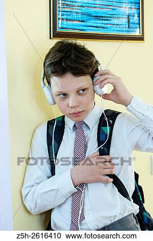 Stock Image - Russia. Belgorod region. Village Solomino. The boy twelve years preparing for school.. Fotosearch