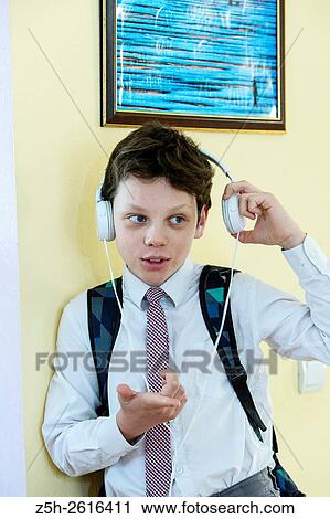 Russia. Belgorod region. Village Solomino. The boy twelve years preparing for school. View Large Photo Image Stock Image - Russia. Belgorod region. Village Solomino. The boy twelve years preparing for school.. Fotosearch
