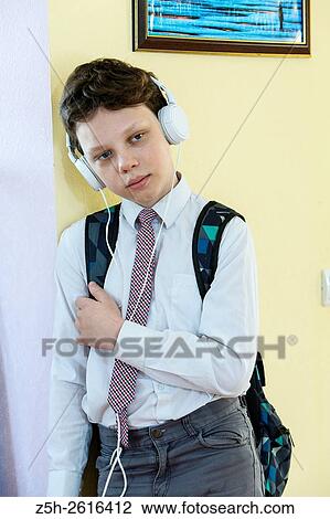 Stock Image - Russia. Belgorod region. Village Solomino. The boy twelve years preparing for school.. Fotosearch