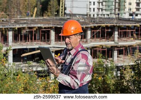 Russian Federation. Belgorod. Builder-installer working. View Large Photo Image Stock Photo - Russian Federation. Belgorod. Builder-installer working.. Fotosearch