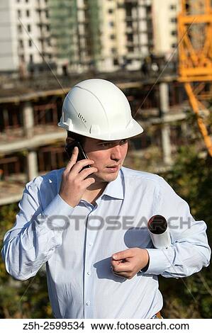 Russian Federation. Belgorod. Young engineer on a construction site. View Large Photo Image Picture - Russian Federation. Belgorod. Young engineer on a construction site.. Fotosearch