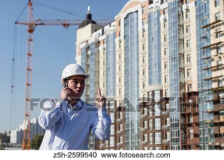 Stock Image - Russian Federation. Belgorod. Young engineer on a construction site.. Fotosearch