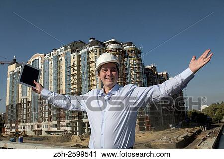 Stock Image - Russian Federation. Belgorod. Young engineer on a construction site.. Fotosearch