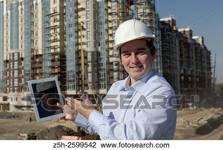 Russian Federation. Belgorod. Young engineer on a construction site. View Large Photo Image Stock Image - Russian Federation. Belgorod. Young engineer on a construction site.. Fotosearch