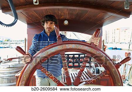 Sailor at the helm of a sailboat, galleon. Basque Country. Spain View Large Photo Image Picture - Sailor at the helm of a sailboat, galleon. Basque Country. Spain. Fotosearch