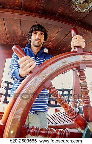 Sailor at the helm of a sailboat, galleon. Basque Country. Spain View Large Photo Image Stock Photography - Sailor at the helm of a sailboat, galleon. Basque Country. Spain. Fotosearch