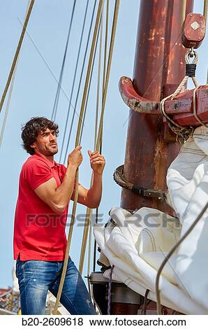 Stock Photo - Sailor. Ropes sail of a sailboat, galleon. Basque Country. Spain. Fotosearch