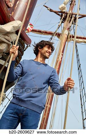 Stock Photo - Sailor. Ropes sail of a sailboat, galleon. Basque Country. Spain. Fotosearch