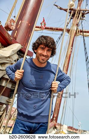 Stock Photo - Sailor. Ropes sail of a sailboat, galleon. Basque Country. Spain. Fotosearch
