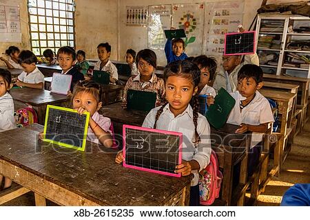 School children in class in the village of Kampong Tralach on the Tonle Sap River, Kampong Chhnang Province, Cambodia, Khmer. View Large Photo Image Stock Photography - School children in class in the village of Kampong Tralach on the Tonle Sap River, Kampong Chhnang Province, Cambodia, Khmer.. Fotosearch