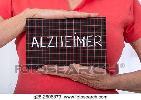 Senior Woman? s hands holding a black slate with Alzheimer written on it View Large Photo Image Stock Image - Senior Woman? s hands holding a black slate with Alzheimer written on it. Fotosearch
