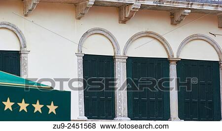 Shuttered windows and four stars on a hotel canopy, Venice, Veneto, Italy, Europe. View Large Photo Image Stock Photo - Shuttered windows and four stars on a hotel canopy, Venice, Veneto, Italy, Europe.. Fotosearch