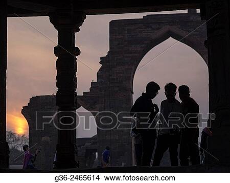 Silhouette of girls at Qutub Minar, New Delhi, India. View Large Photo Image Picture - Silhouette of girls at Qutub Minar, New Delhi, India.. Fotosearch