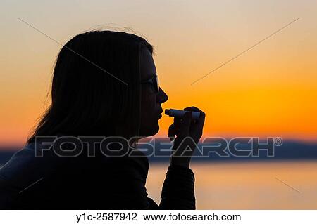 Stock Image - Silhouetting lips make-up fix. Fotosearch