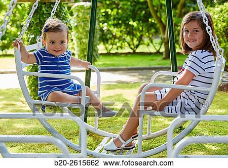 Sisters playing in the park. Girls. Getaria. Gipuzkoa. Basque Country. Spain View Large Photo Image Stock Image - Sisters playing in the park. Girls. Getaria. Gipuzkoa. Basque Country. Spain. Fotosearch