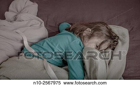 Six year old girl on her bed. View Large Photo Image Stock Photography - Six year old girl on her bed.. Fotosearch