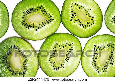 Slices of kiwifruit. View Large Photo Image Stock Photography - Slices of kiwifruit.. Fotosearch