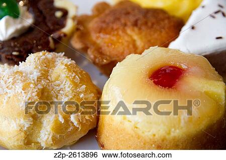 Stock Photograph - Small cakes with different stuffing.. Fotosearch