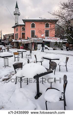 Snow and ice covering cafe chairs and tables at Karakoy, Istanbul, Turkey. View Large Photo Image Stock Photo - Snow and ice covering cafe chairs and tables at Karakoy, Istanbul, Turkey.. Fotosearch