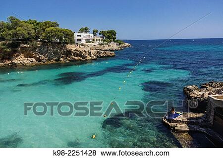 Spain, Balearic Islands, Mallorca, Calvia, Bendinat Beach at Mediterranean Sea View Large Photo Image Stock Photo - Spain, Balearic Islands, Mallorca, Calvia, Bendinat Beach at Mediterranean Sea. Fotosearch