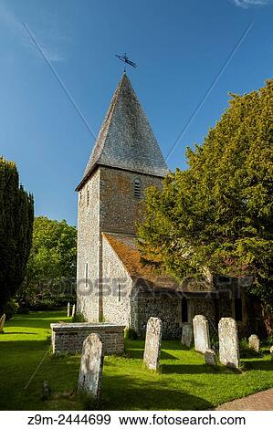 Stock Photo - Spring afternoon at St Peter's church in the village of Rodmell, East Sussex, England. South Downs National Park. Ouse Valley.. Fotosearch