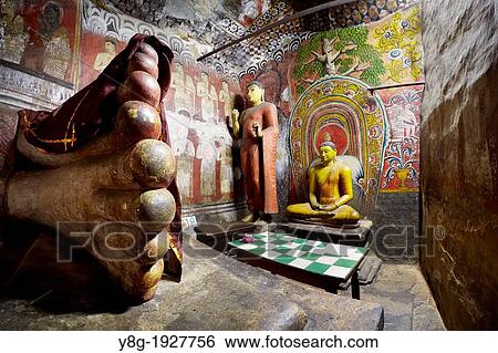 Stock Photograph - Sri Lanka - Buddish Cave Temple Dambulla, Buddha statues inside, Kandy province, UNESCO World Heritage Site, central region of Sri Lanka Island. Fotosearch