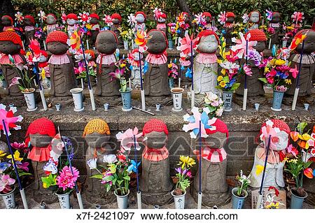 Stock Photo - Statues of Jizo dedicated to dead unborn children, in Zojoji temple, Tokyo, Japan.. Fotosearch