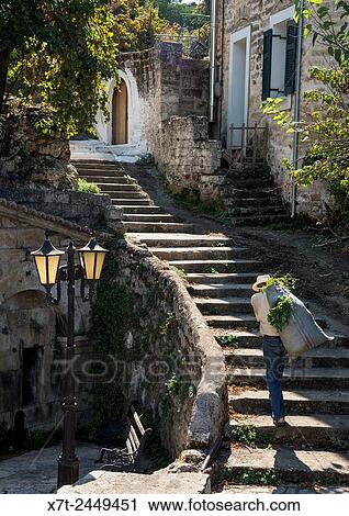 Steet scene in the village of Proastio, near Kardamyli in the Outer Mani, Southern Peloponnese, Greece. View Large Photo Image Stock Image - Steet scene in the village of Proastio, near Kardamyli in the Outer Mani, Southern Peloponnese, Greece.. Fotosearch