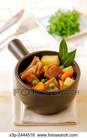 Stock Photograph - Stewed lamb with vegetables.. Fotosearch