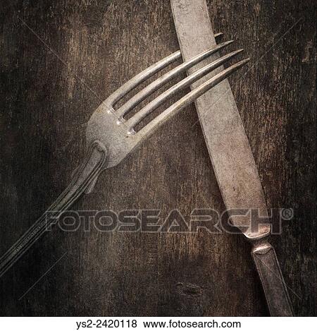 Still life with silverware on table. Knife and fork on a wooden background. View Large Photo Image Stock Photo - Still life with silverware on table. Knife and fork on a wooden background.. Fotosearch