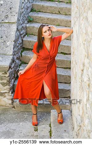 Stock Photo - Stock Photo - Pretty young woman in long Red dress. Fotosearch