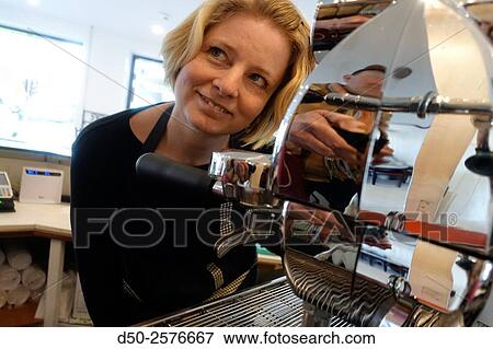 Stock Photo - STOCKHOLM SWEDEN Cafe owner with new espresso machine.. Fotosearch