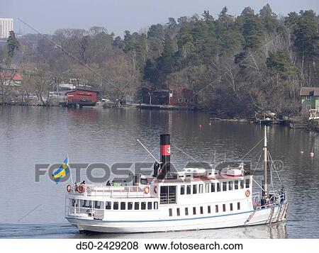 STOCKHOLM SWEDEN Ferry boat making a stop in Mlarhjden, a residential neighborhood on the shores of Lake Mlaren. View Large Photo Image Stock Photo - STOCKHOLM SWEDEN Ferry boat making a stop in Mlarhjden, a residential neighborhood on the shores of Lake Mlaren.. Fotosearch