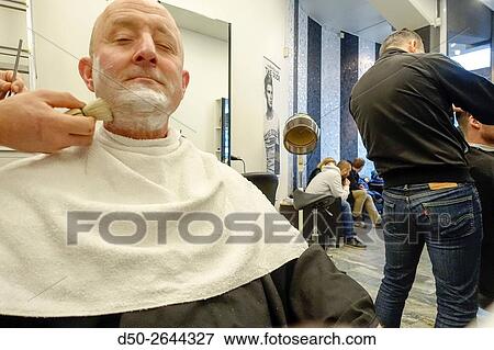 STOCKHOLM, SWEDEN Man gets a razor shave. View Large Photo Image Stock Photo - STOCKHOLM, SWEDEN Man gets a razor shave.. Fotosearch