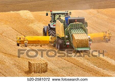 Straw baler. Agricultural machinery. Harvesting of cereals, ½Learza½ estate. Near Estella, Navarre, Spain View Large Photo Image Stock Image - Straw baler. Agricultural machinery. Harvesting of cereals, ½Learza½ estate. Near Estella, Navarre, Spain. Fotosearch