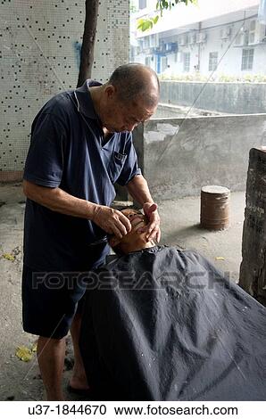 Street barbers at outskirt of Guangzhou, China. View Large Photo Image Stock Image - Street barbers at outskirt of Guangzhou, China.. Fotosearch