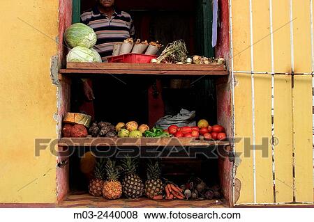 Stock Photo - Street scene colorful houses small shop Trinidad Cuba.. Fotosearch