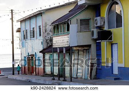 Streetscene with wooden houses in the center of Soufri? re and a woman just turning around the corner, St Lucia, Windward Islands, Lesser Antilles, Eastern Caribbean Islands, West Indies, Americas. View Large Photo Image Picture - Streetscene with wooden houses in the center of Soufri? re and a woman just turning around the corner, St Lucia, Windward Islands, Lesser Antilles, Eastern Caribbean Islands, West Indies, Americas.. Fotosearch