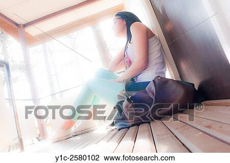 Student young woman sitting against bright sunlight View Large Photo Image Stock Image - Student young woman sitting against bright sunlight. Fotosearch