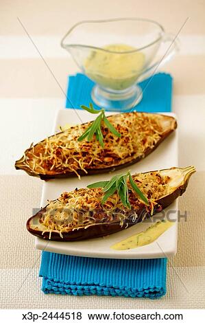 Stock Photo - Stuffed aubergines with quinoa.. Fotosearch