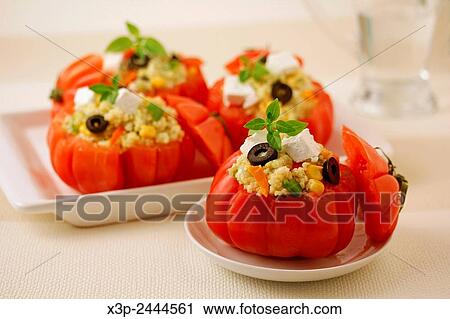 Stock Image - Stuffed tomatoes with millet.. Fotosearch