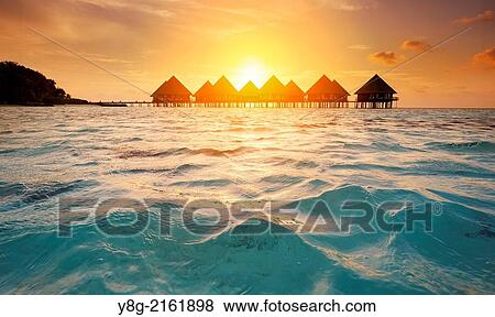 Stock Photo - Sunset at Maldives, Ari Atol, Indian Ocean.. Fotosearch