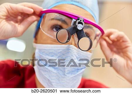 Surgeon with magnifying glasses. Surgical glasses. Plastic surgery. View Large Photo Image Stock Image - Surgeon with magnifying glasses. Surgical glasses. Plastic surgery.. Fotosearch