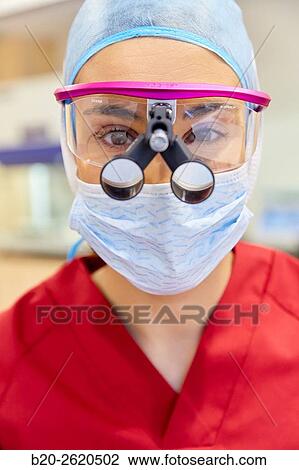 Surgeon with magnifying glasses. Surgical glasses. Plastic surgery. View Large Photo Image Stock Image - Surgeon with magnifying glasses. Surgical glasses. Plastic surgery.. Fotosearch