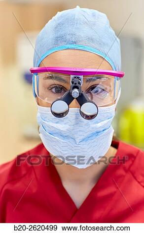 Surgeon with magnifying glasses. Surgical glasses. Plastic surgery. View Large Photo Image Stock Photo - Surgeon with magnifying glasses. Surgical glasses. Plastic surgery.. Fotosearch