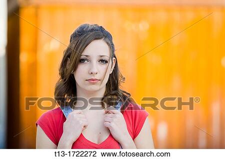 Teen girl is posing before a bright metal plate View Large Photo Image Stock Image - Teen girl is posing before a bright metal plate. Fotosearch