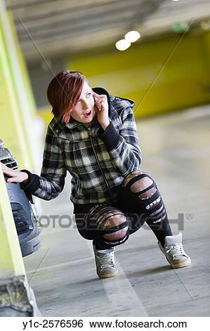 Teen girl is shocked talking on cellphone is wondering View Large Photo Image Stock Photograph - Teen girl is shocked talking on cellphone is wondering. Fotosearch