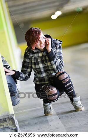 Teen girl is talking on cellphone hiding View Large Photo Image Stock Photography - Teen girl is talking on cellphone hiding. Fotosearch