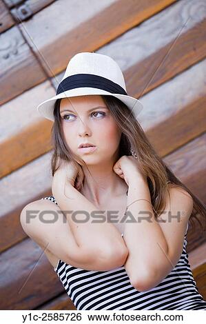 Stock Photograph - Teen girl portrait with small hat. Fotosearch